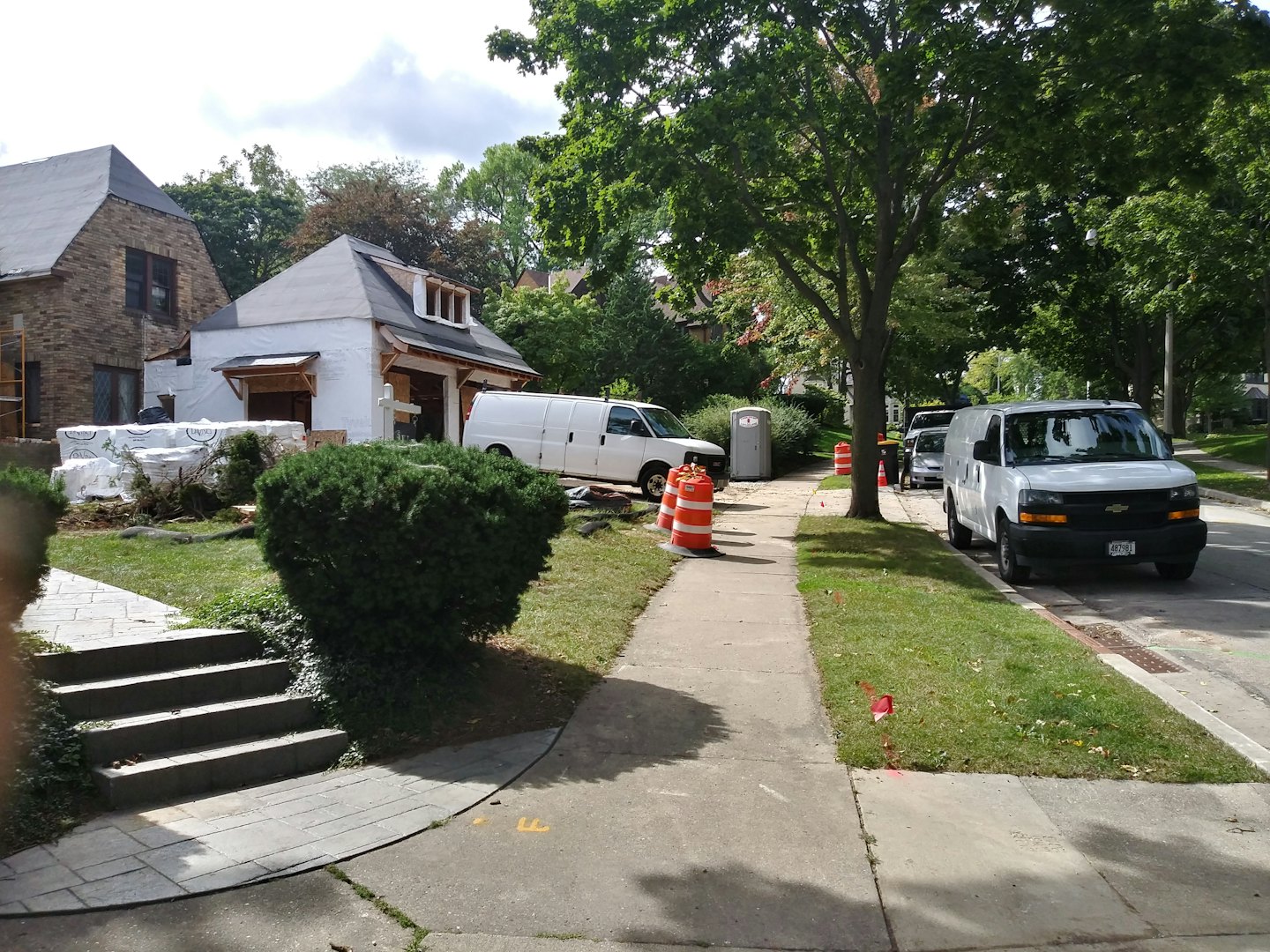 Construction crew building an addition on a residential house.